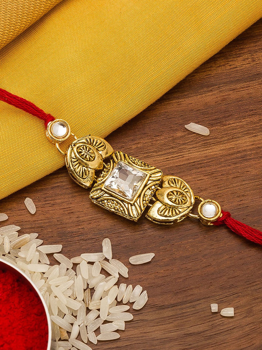 

Aadita Men Gold Toned & Stone-Studded Rakhi
