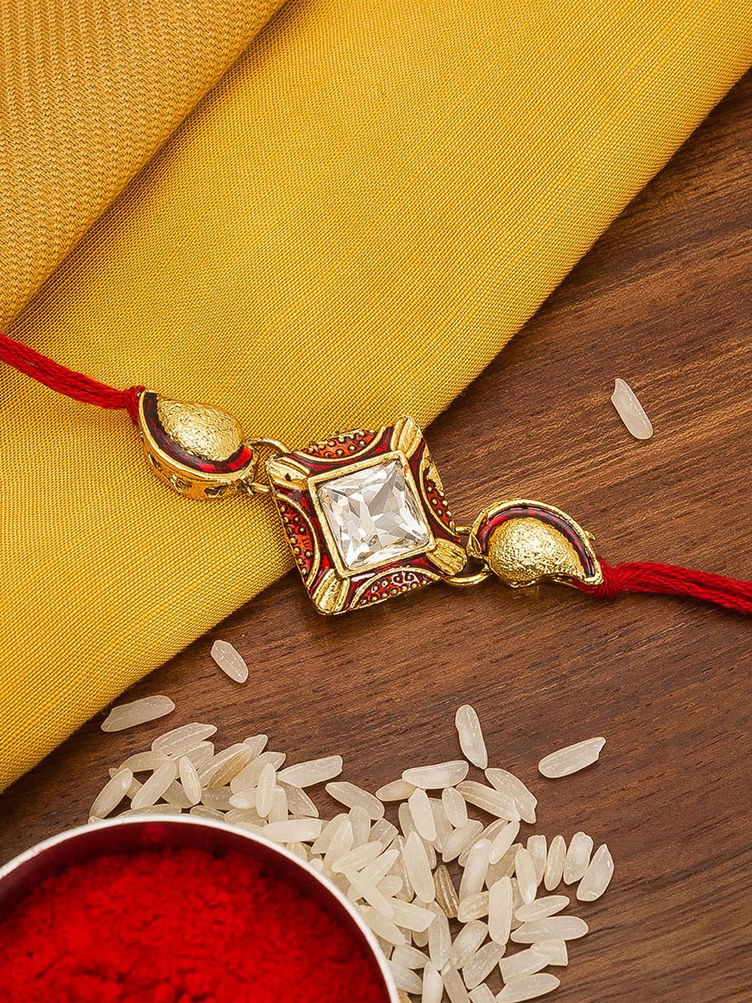

aadita Men Gold-Colored & White Stone-Studded Handmade Rakhi