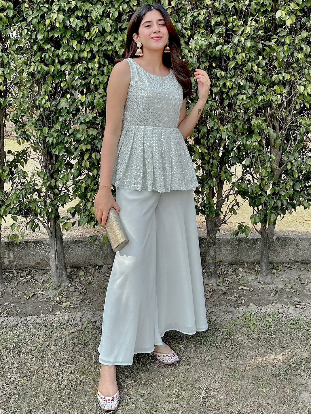 

Libas Green Embroidered Empire Sequinned Kurti with Palazzos & Potli