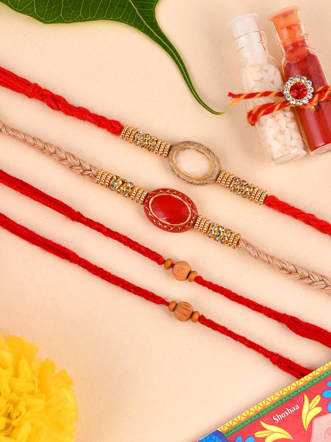 

Shoshaa Set of 4 Beige & Red Bhai Rakhi With Roli Chawal