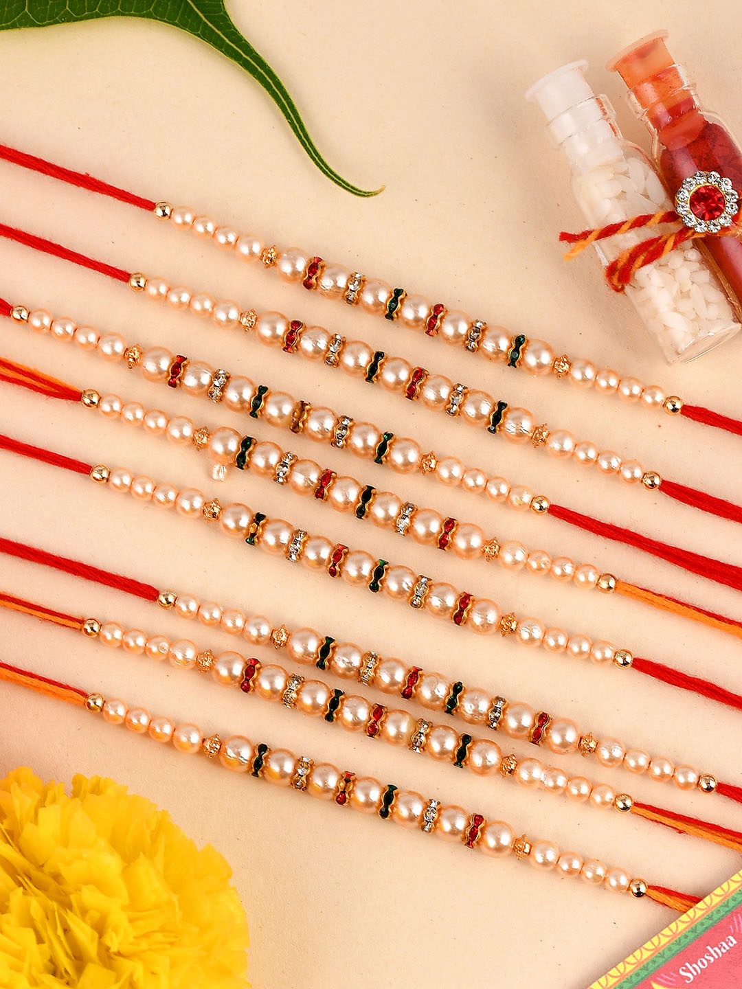 

Shoshaa Set of 8 Red and Gold Pearls Bro Rakhi