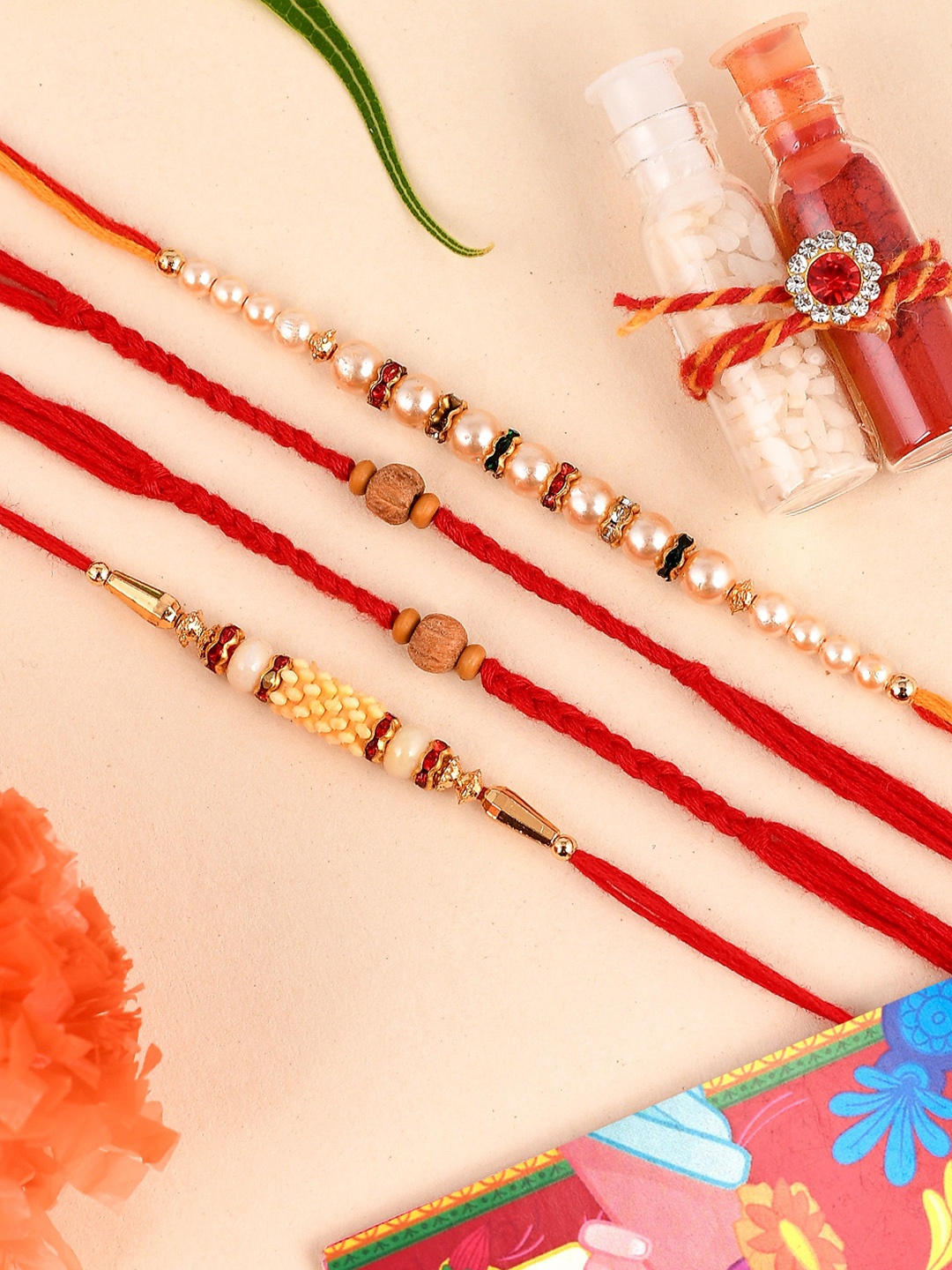 

Shoshaa Set of 4 Red Gold-Toned Rudraksh With White Beaded Combo Bhai Rakhi