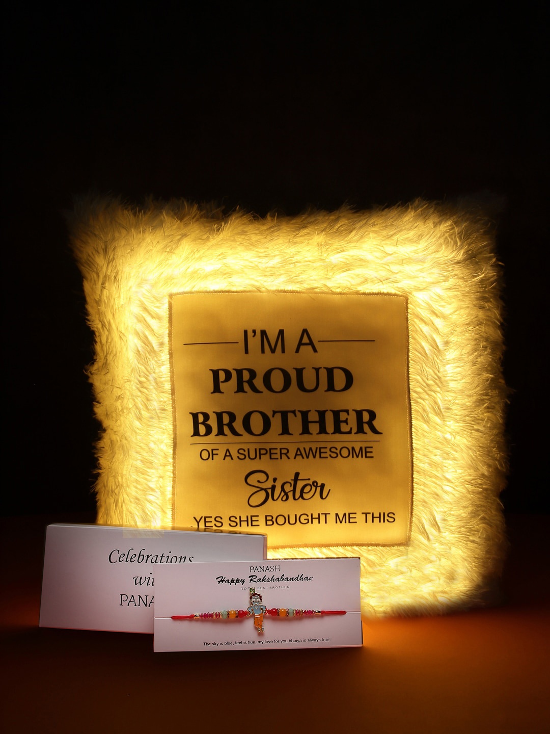 

PANASH Men Multicoloured Sri Krishna Rakhi with LED Pillow Gift Set, Gold