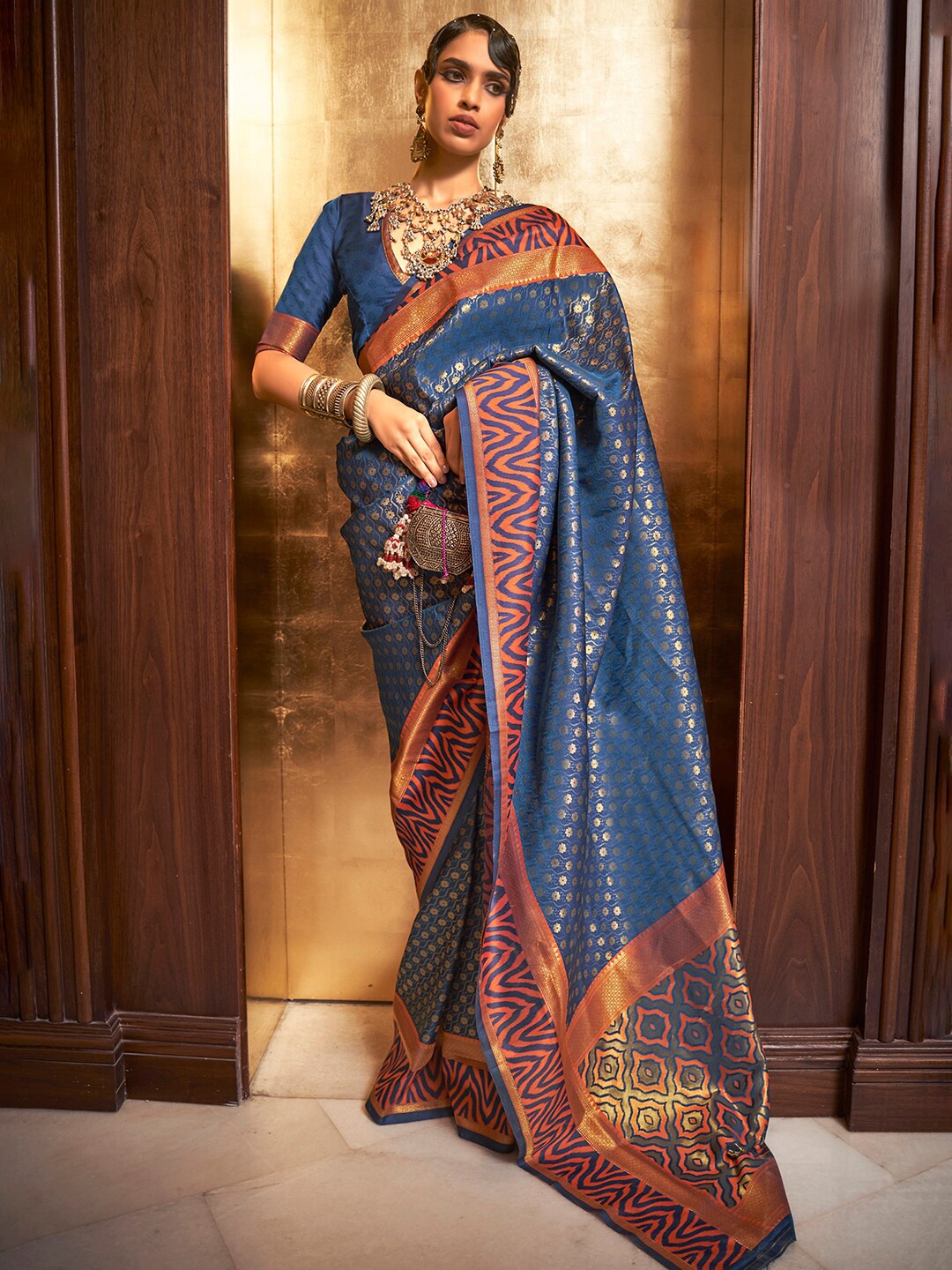 

Mitera Navy Blue & Orange Paisley Silk Blend Banarasi Saree