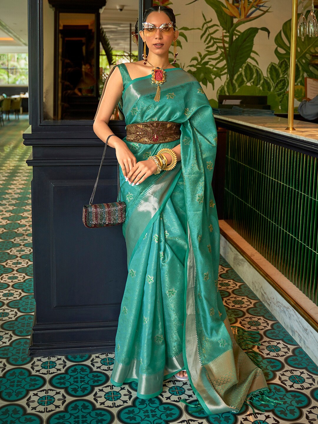 

Mitera Women Teal & Gold-Toned Ethnic Motifs Zari Silk Blend Tussar Saree