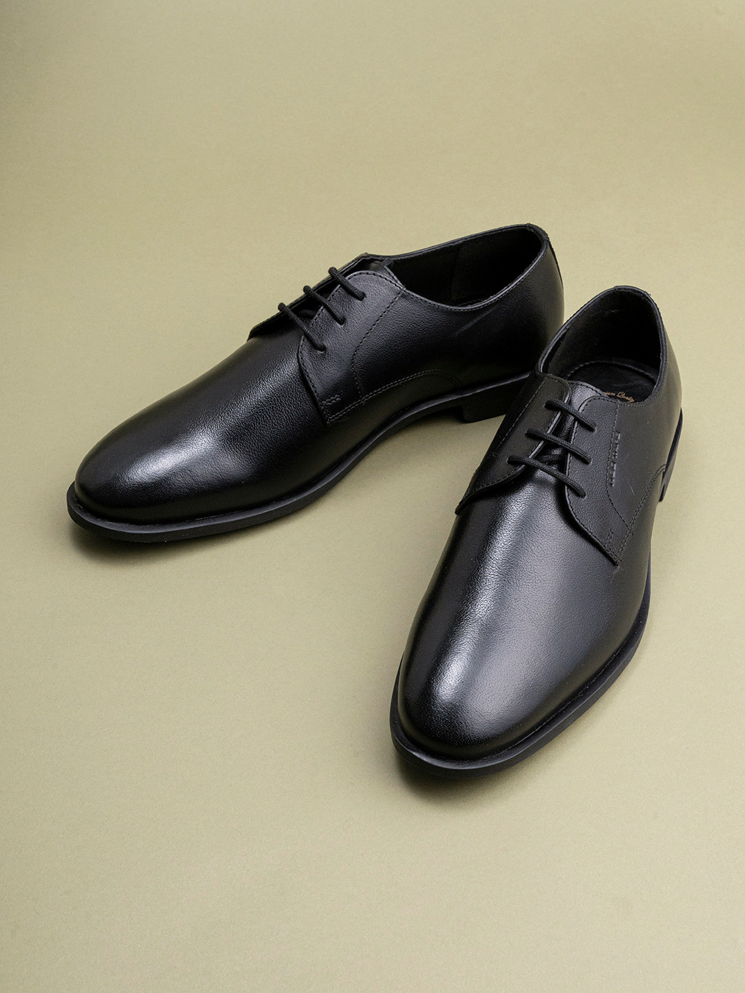 

Red Tape Men Black Solid Formal Leather Derbys