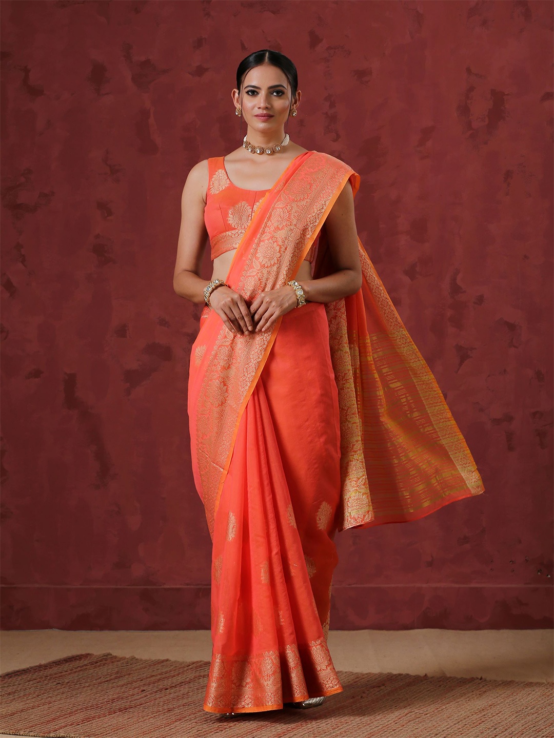 

Swtantra Orange & Gold-Toned Floral Zari Silk Cotton Saree