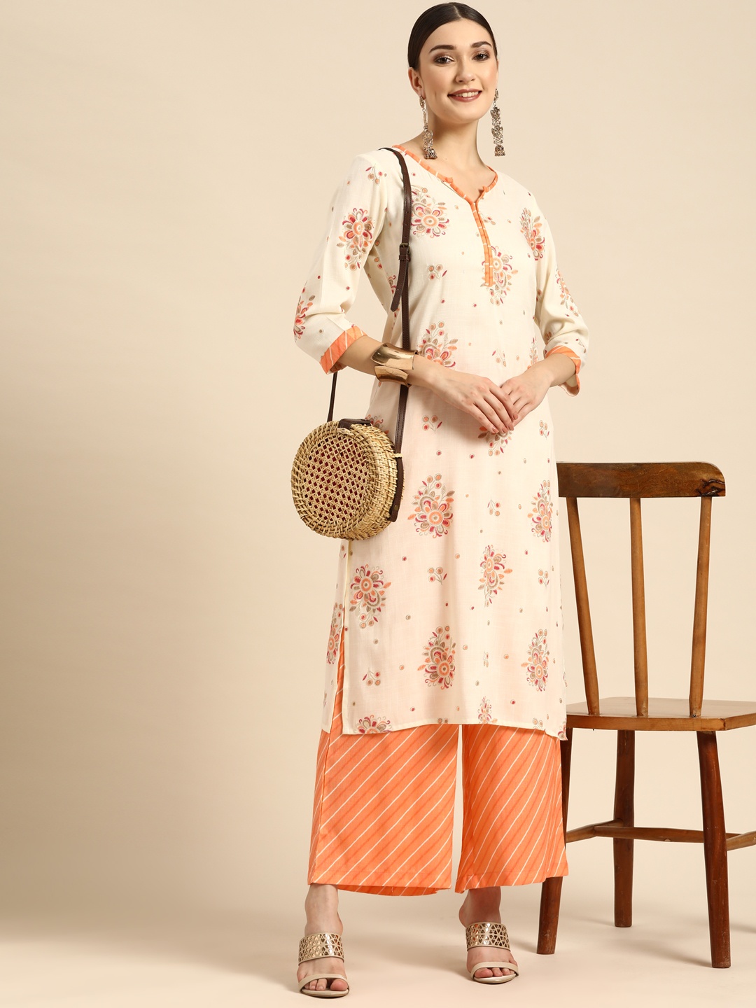 

Sangria Women Orange Floral Printed Thread Work Kurta with Palazzos