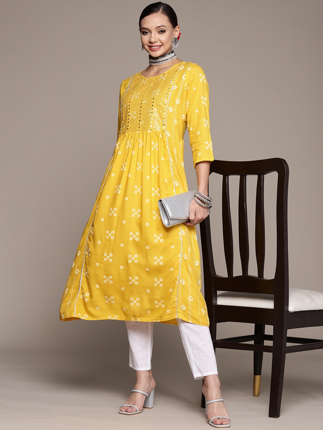 

Anubhutee Women Yellow Bandhani Printed Mirror Work Kurta