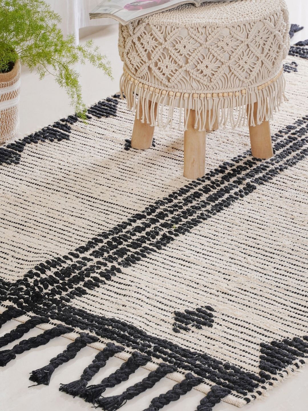 

Nestasia Black and Beige Hand Woven Carpet