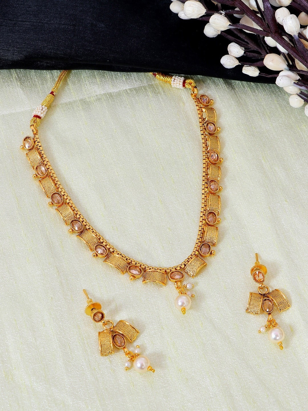 

Crunchy Fashion Gold-Plated White Stone-Studded Beaded Enamelled Jewellery Set