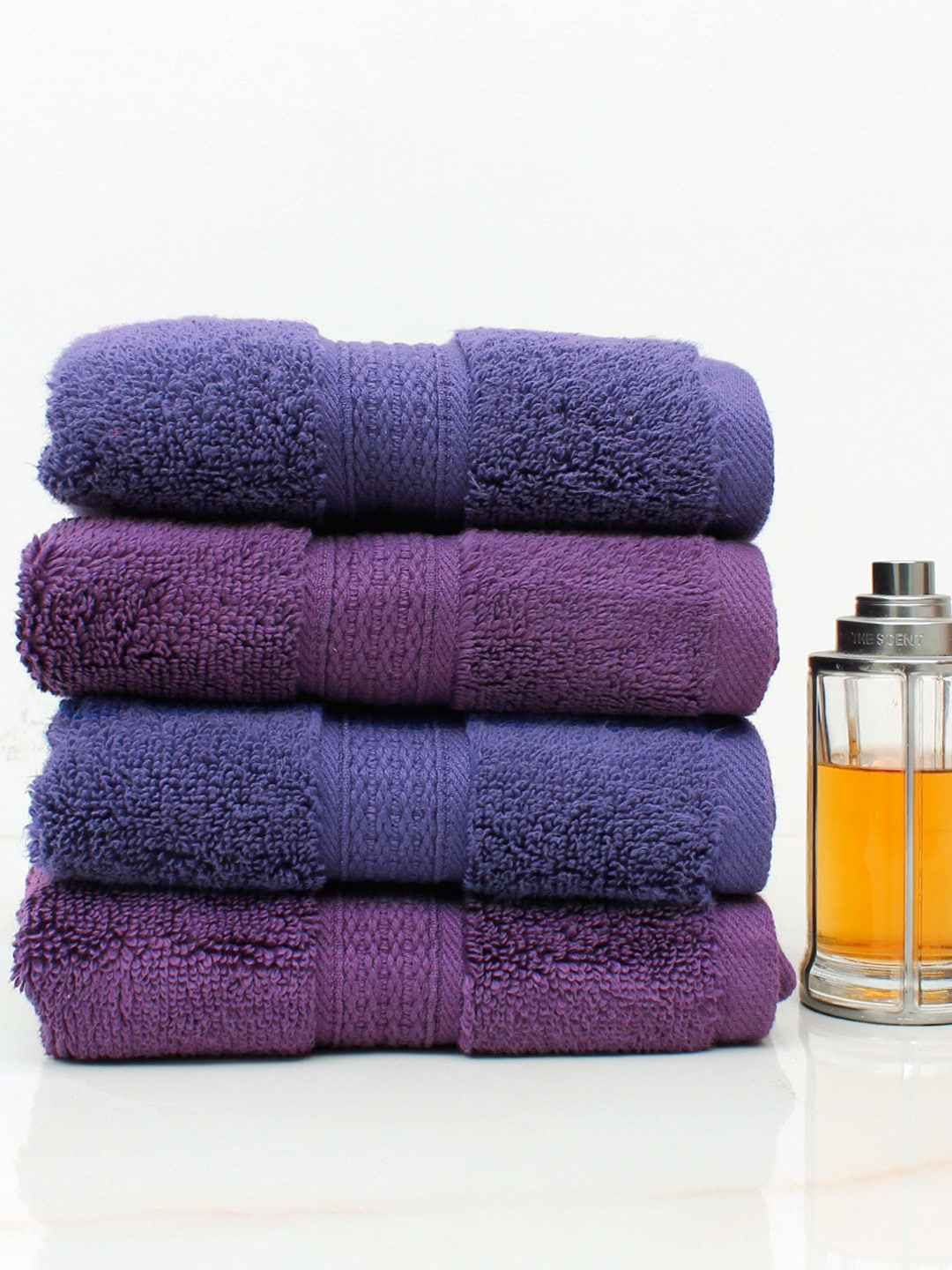 

AVI Living Set Of 4 Purple & Navy Blue Solid 550 GSM Pure Cotton Hand Towels