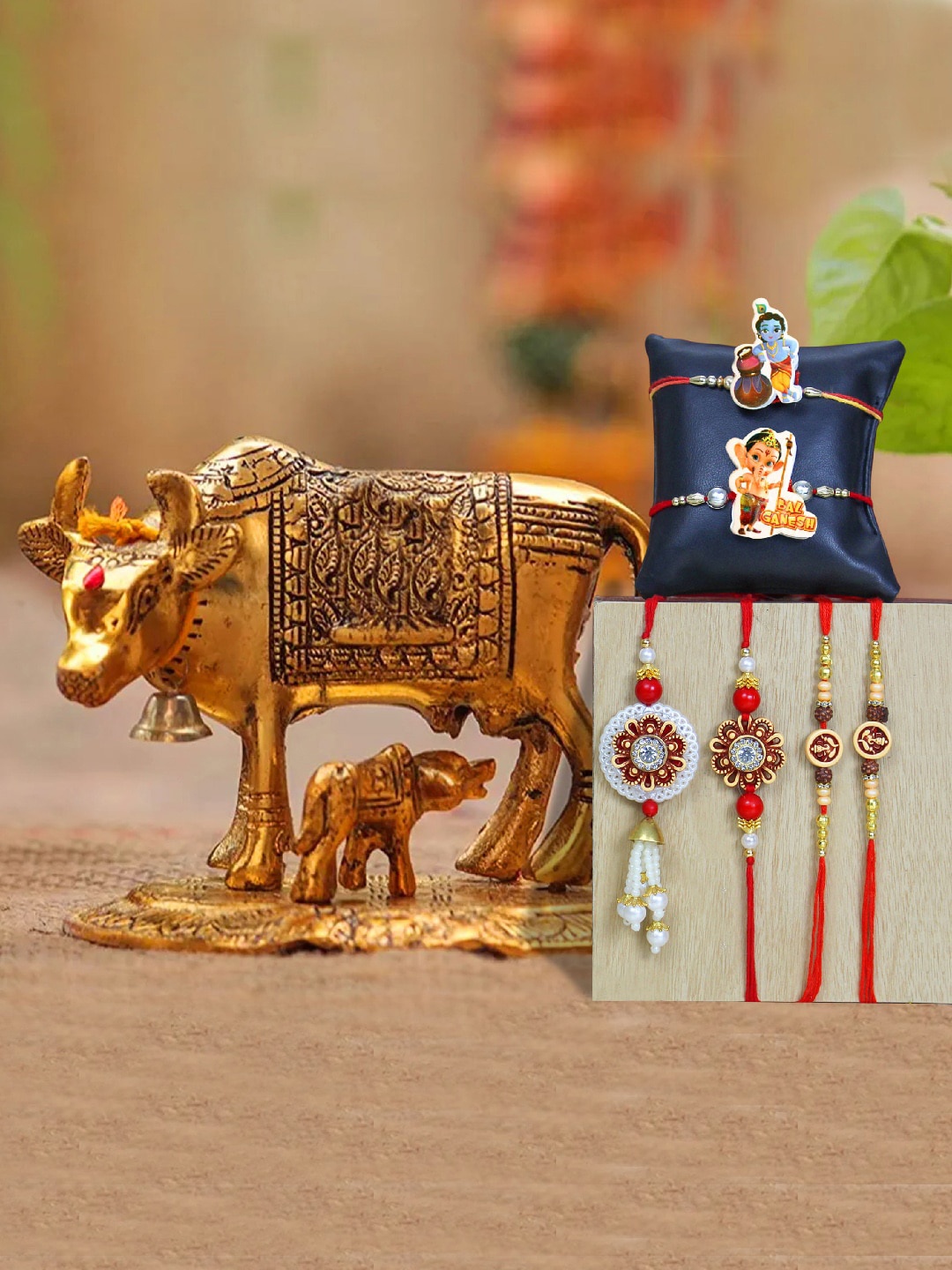 

TIED RIBBONS Pack of 6 Rakhi & Cow with Calf Idol Gift Set, Gold