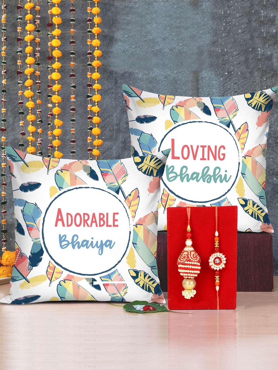 

TIED RIBBONS Bhaiya Bhabhi Rakhi Set With Set of 2 Printed Cushion Gift Set, Red