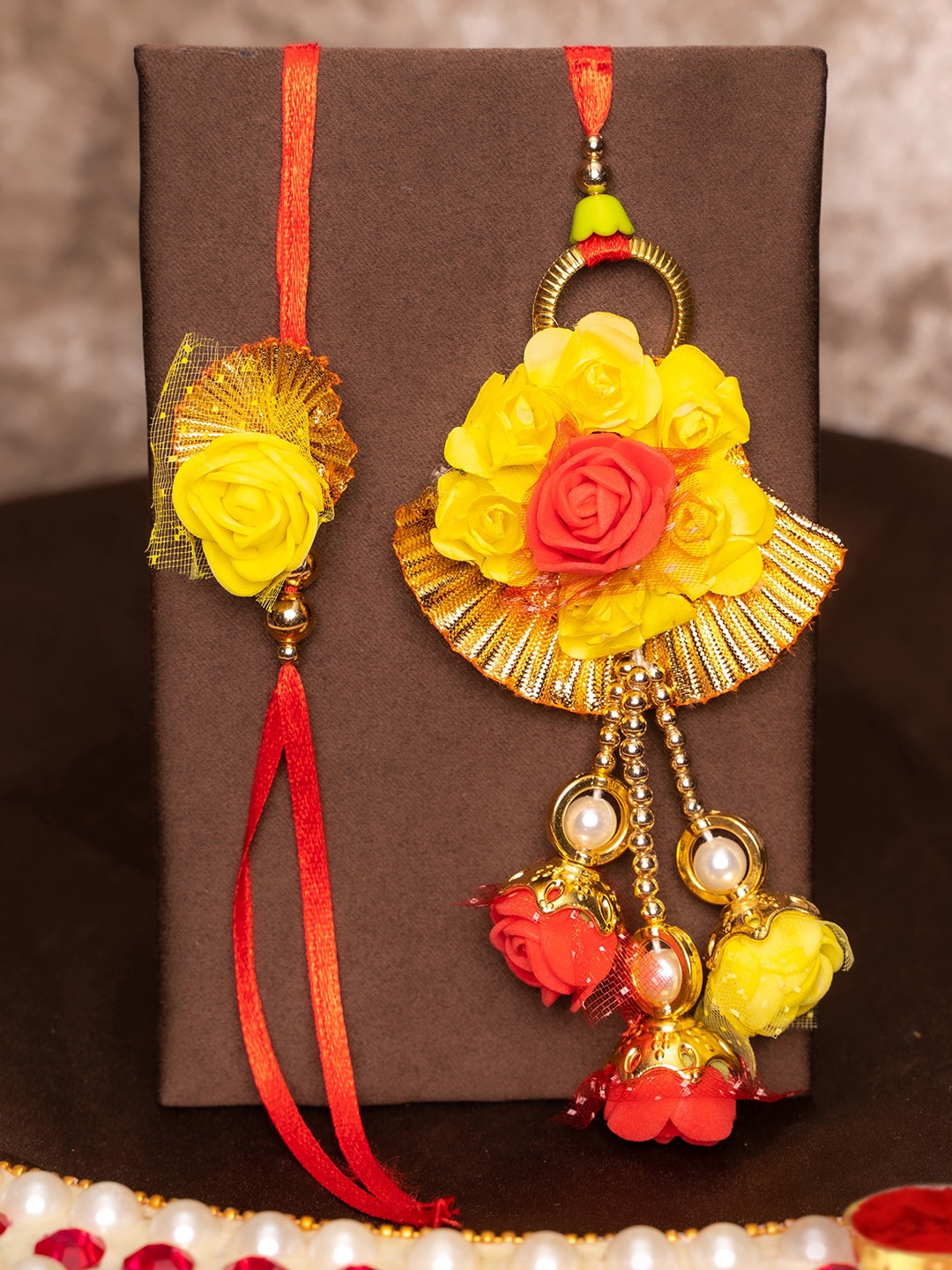 

TIED RIBBONS Bhaiya Bhabhi Floral Lumba Rakhi with Ganesha Idol Gift Set, Multi