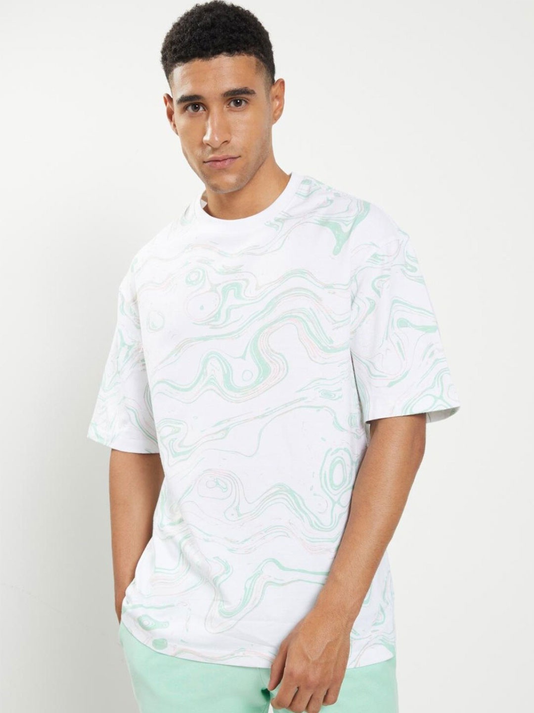 

Bewakoof Men White & magnolia cotton Printed Oversized T-shirt