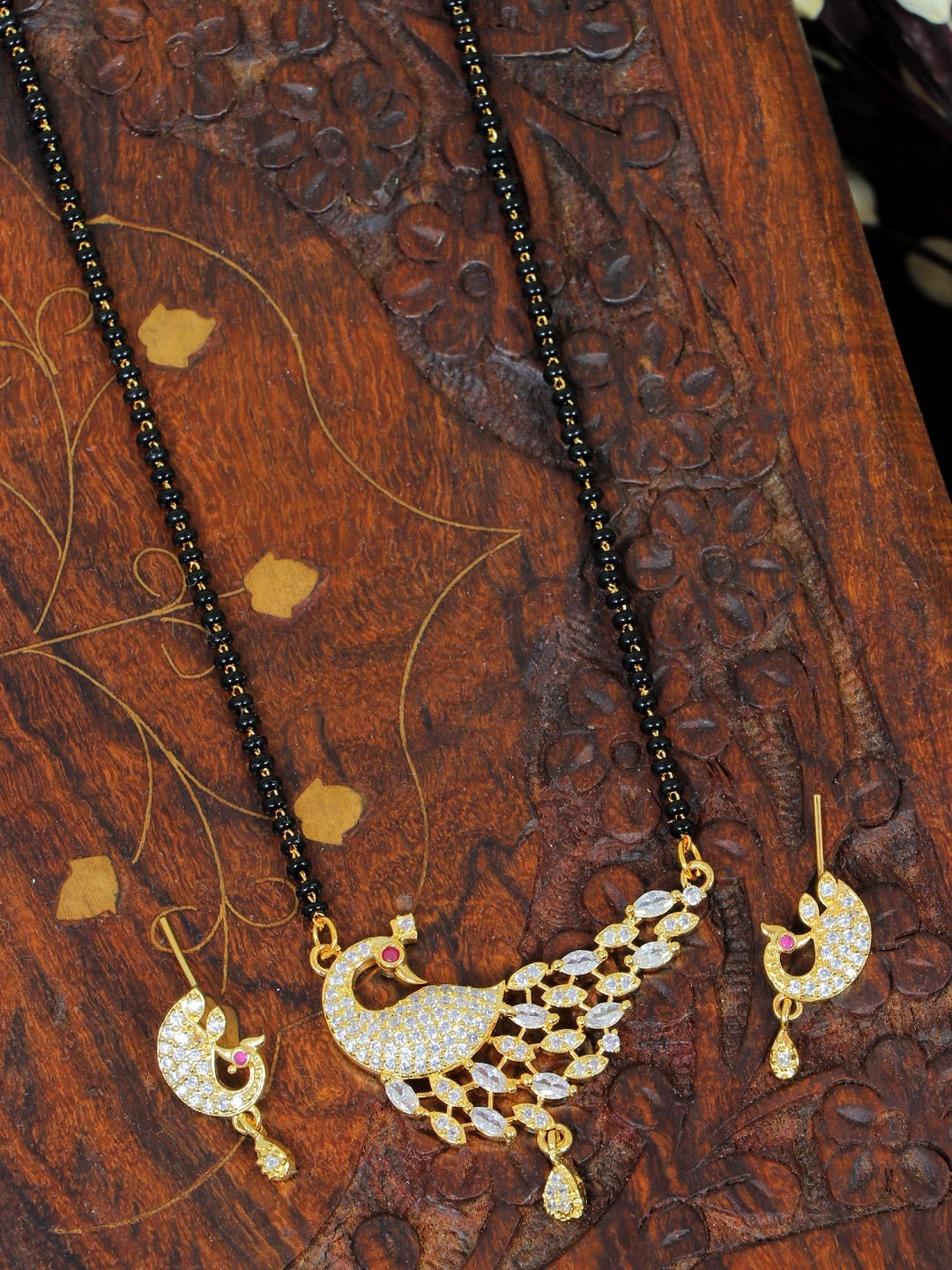 

SwaDev Gold-Plated Peacock White & Black AD Studded Beaded Mangalsutra With Earings