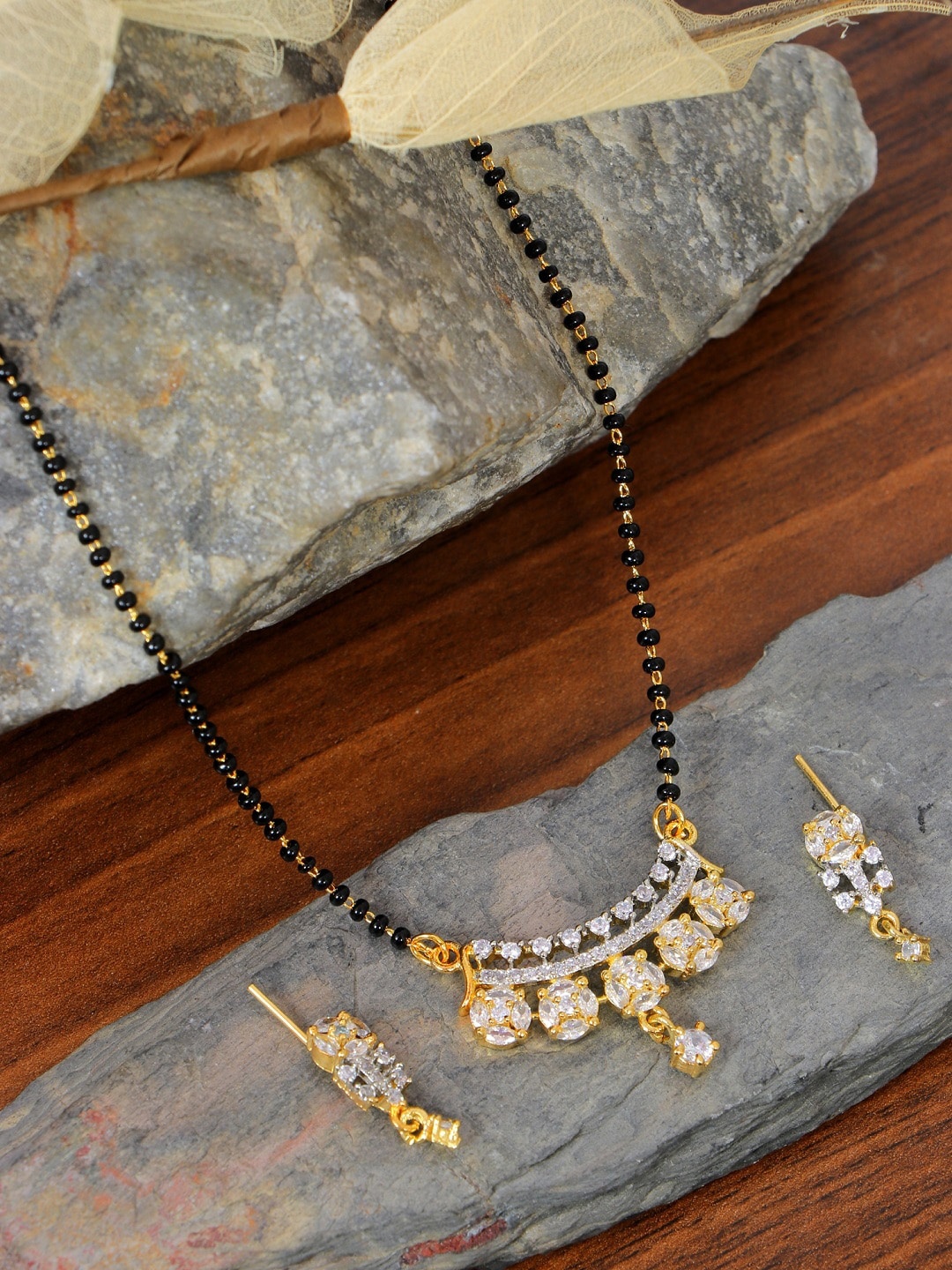

SwaDev Gold-Plated White & Black AD Studded & Beaded Mangalsutra With Earings