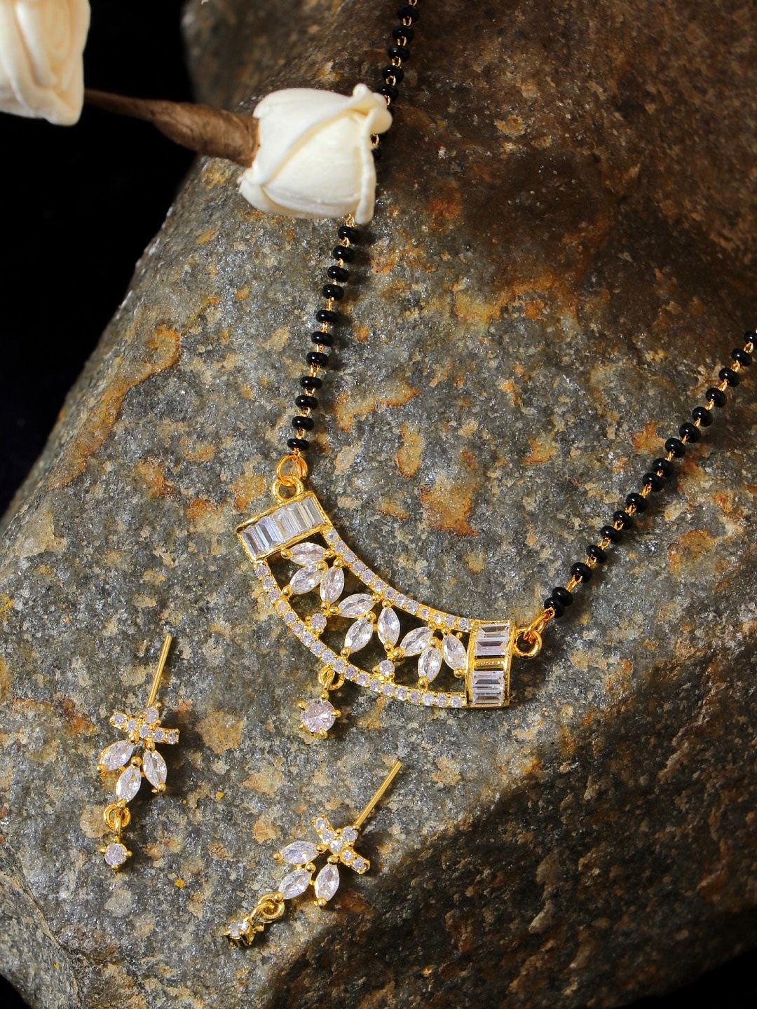 

SwaDev Women Gold-Plated Black Beaded & AD Studded Mangalsutra & Earrings Set