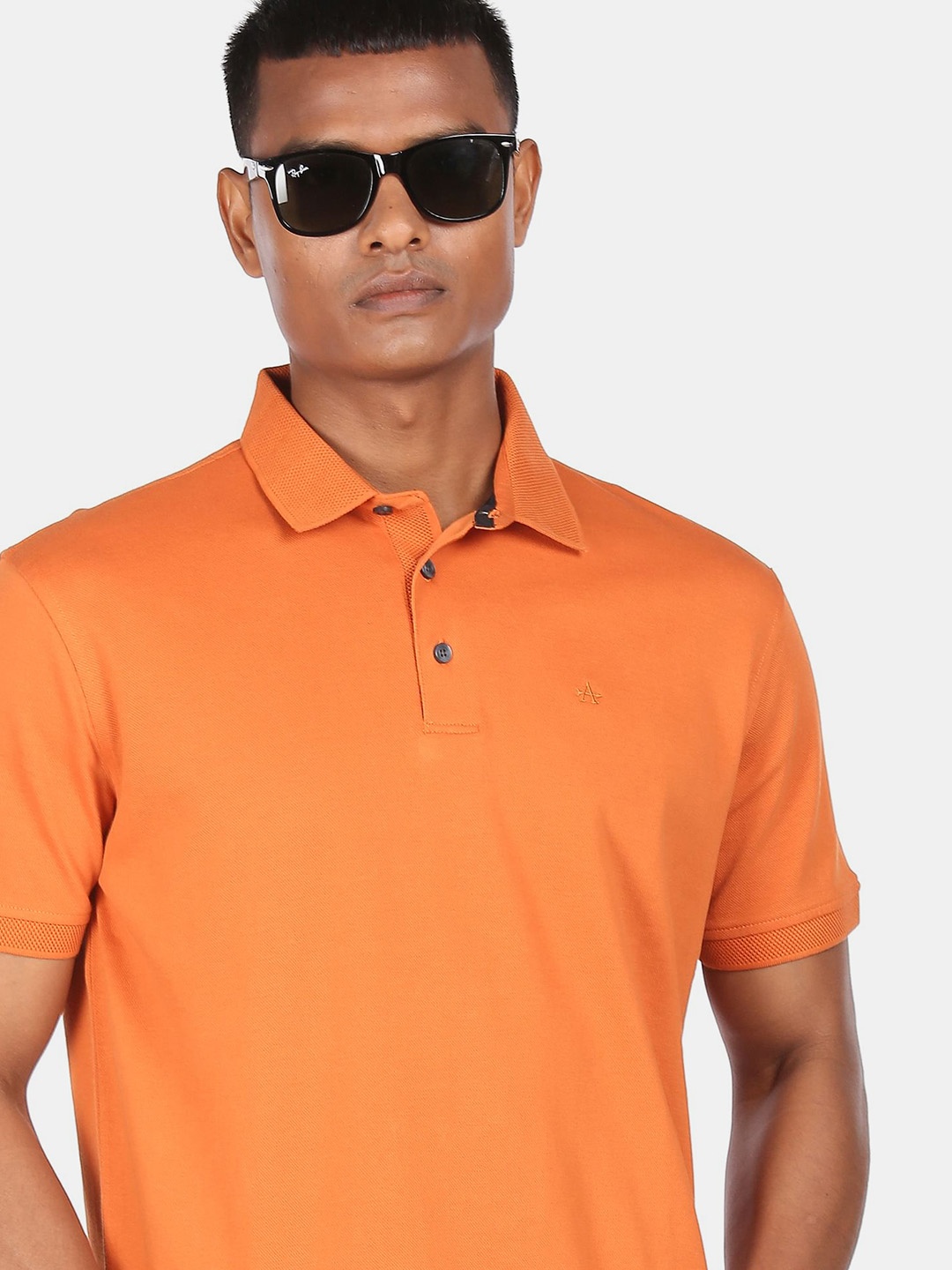 

Arrow Men Orange Solid Polo Collar Cotton T-shirt