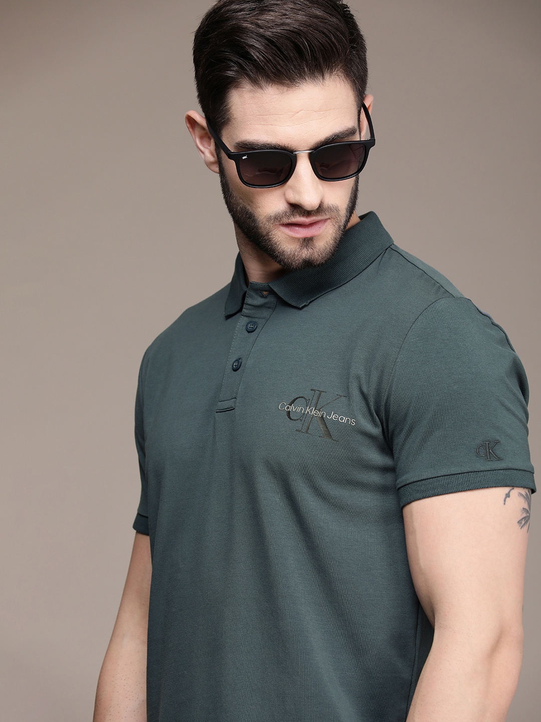 

Calvin Klein Jeans Men Grey Solid Polo Collar Slim Fit Casual T-shirt