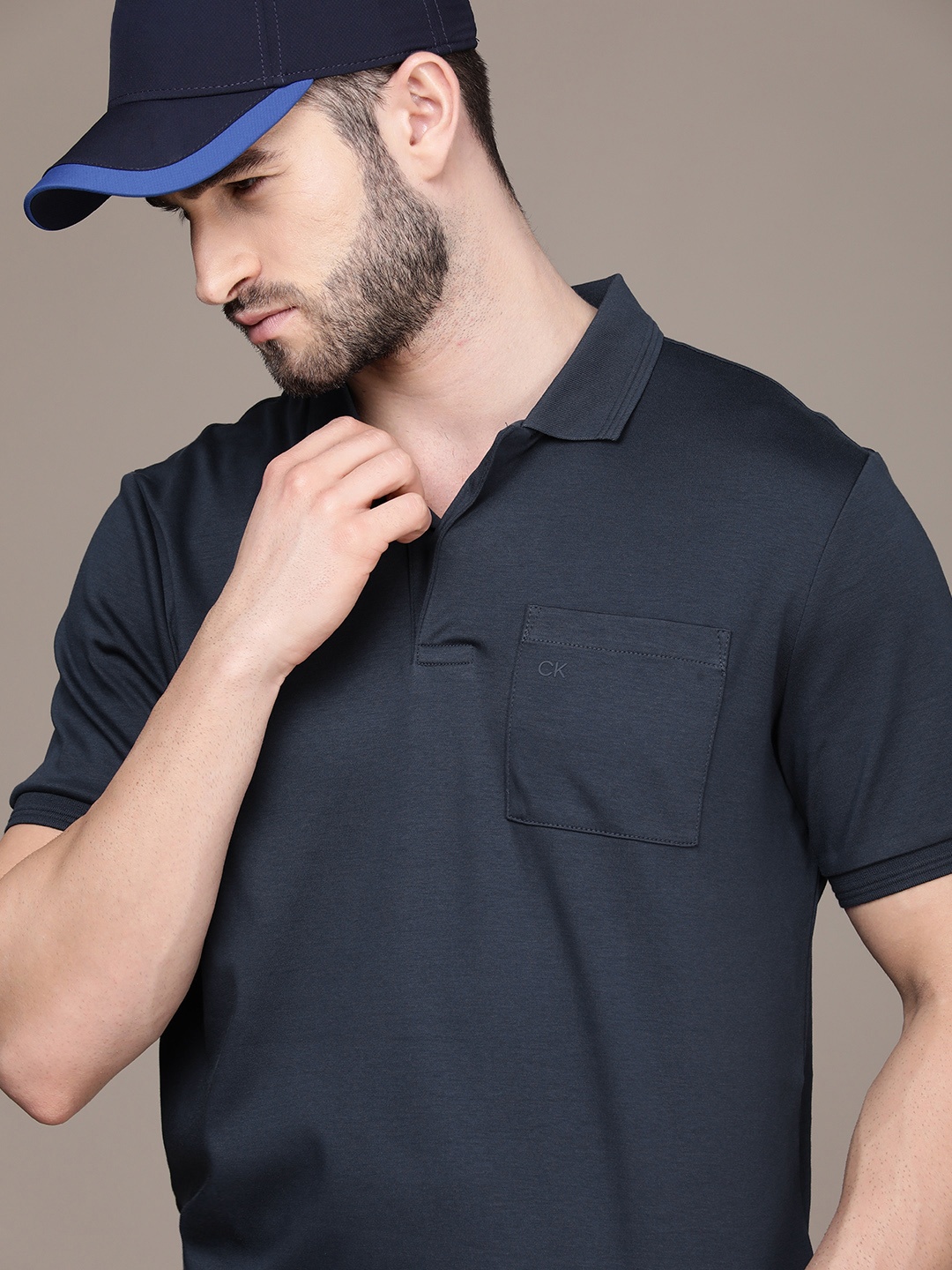 

Calvin Klein Jeans Men Navy Blue Solid Polo Collar Slim Fit Pure Cotton Casual T-shirt