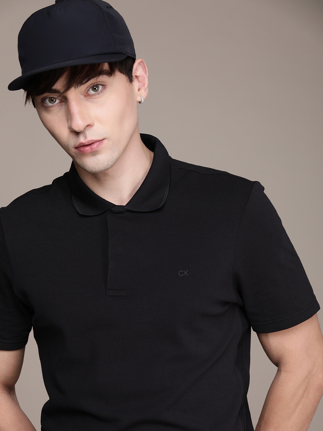 

Calvin Klein Jeans Men Black Solid Polo Collar T-shirt