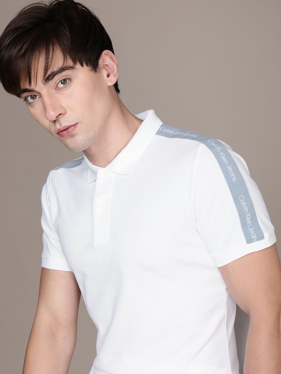 

Calvin Klein Jeans Men White & Blue Brand Logo Printed Polo Collar Slim Fit T-shirt