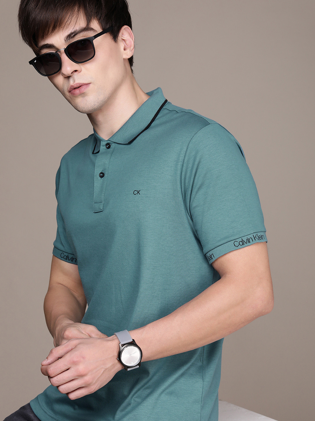 

Calvin Klein Jeans Men Blue Brand Logo Printed Pure Cotton Polo Collar T-shirt
