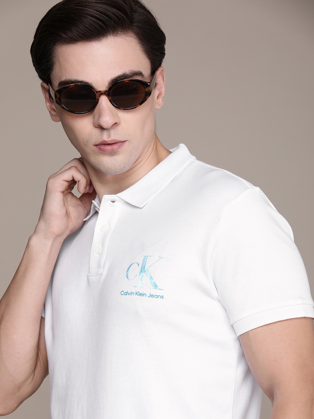 

Calvin Klein Jeans Men White Solid Applique Brand Logo Polo Collar Pure Cotton T-shirt