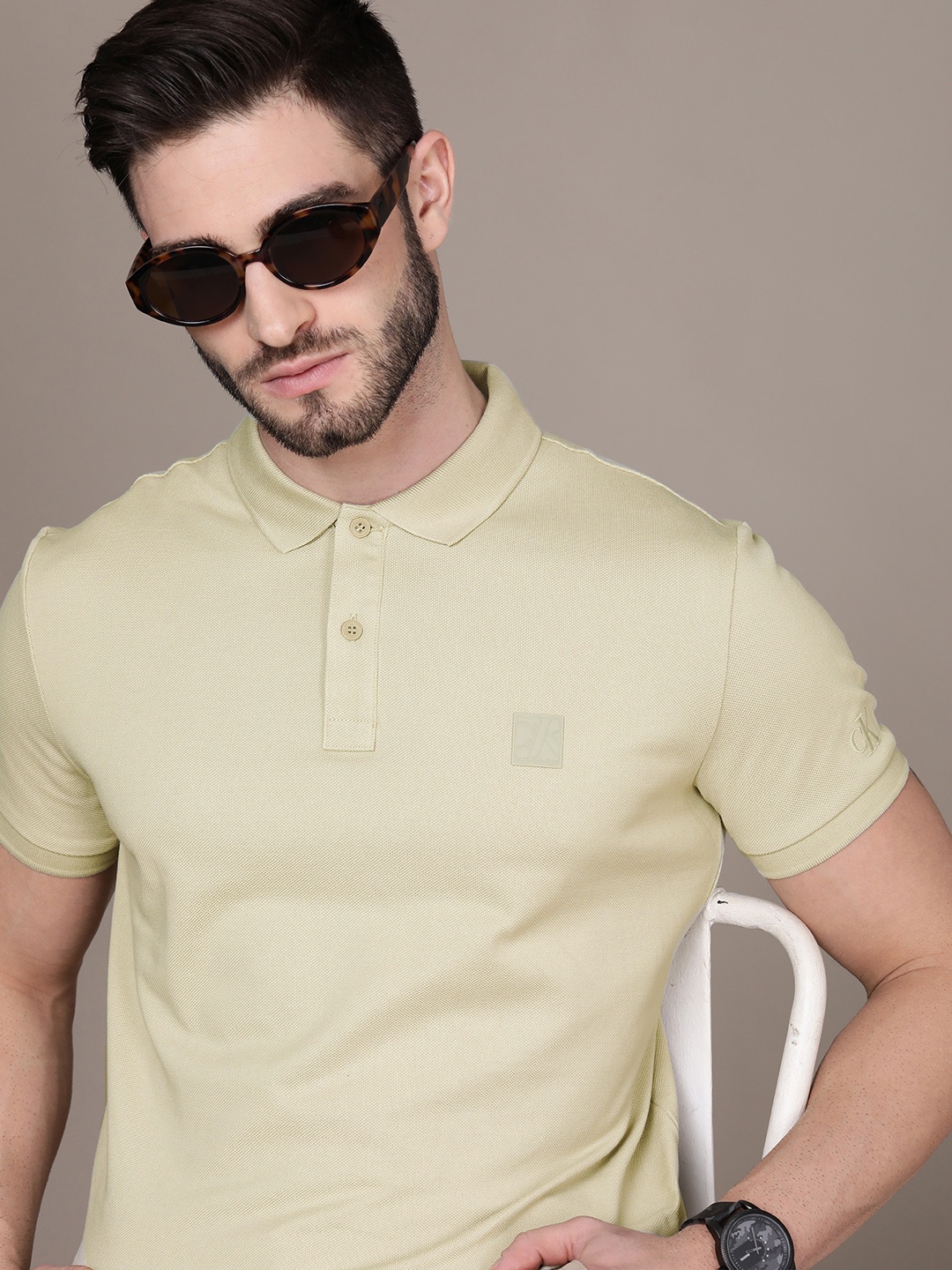 

Calvin Klein Jeans Men Beige Brand Logo Printed Polo Collar Pure Cotton T-shirt