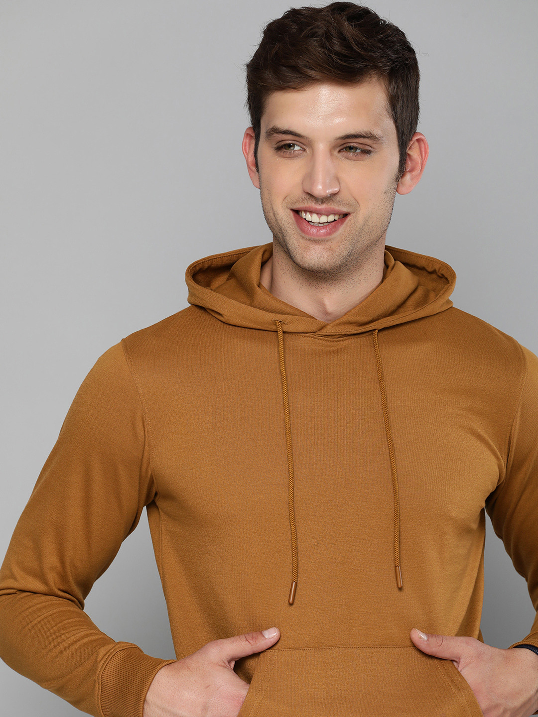 

Mast & Harbour Men Khaki Solid Hooded Sweatshirt