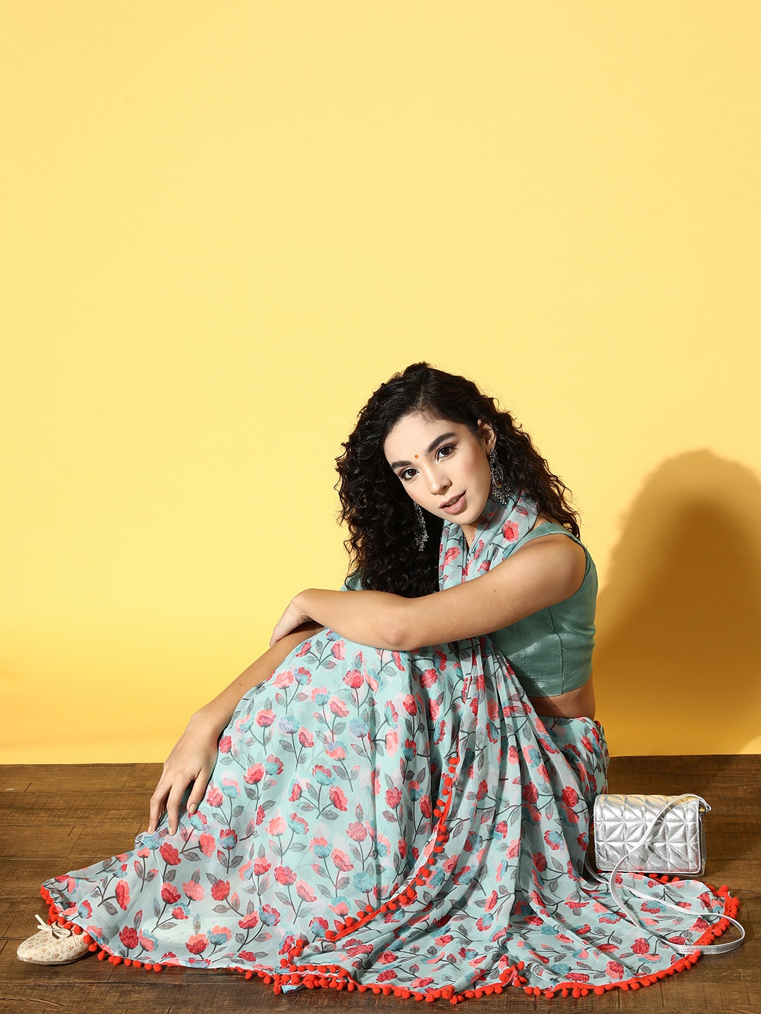 

Tikhi Imli Blue & Peach-Coloured Floral Saree