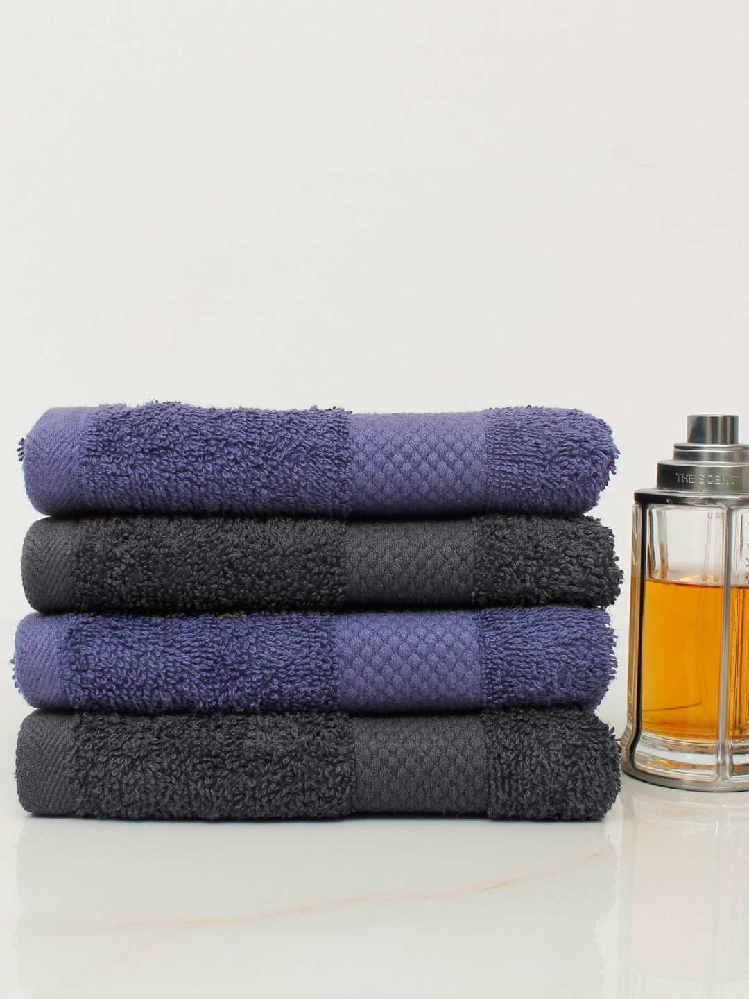 

AVI Living Set Of 4 Blue & Black Solid 500 GSM Pure Cotton Hand Towels
