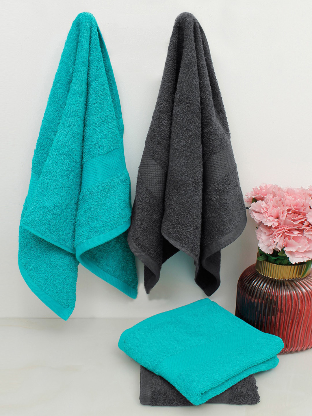 

AVI Living Set Of 4 Blue & Black Solid 500 GSM Pure Cotton Hand Towels
