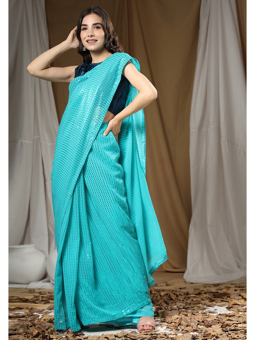 

ORUS Turquoise Blue Embellished Sequinned Pure Georgette Heavy Work Saree