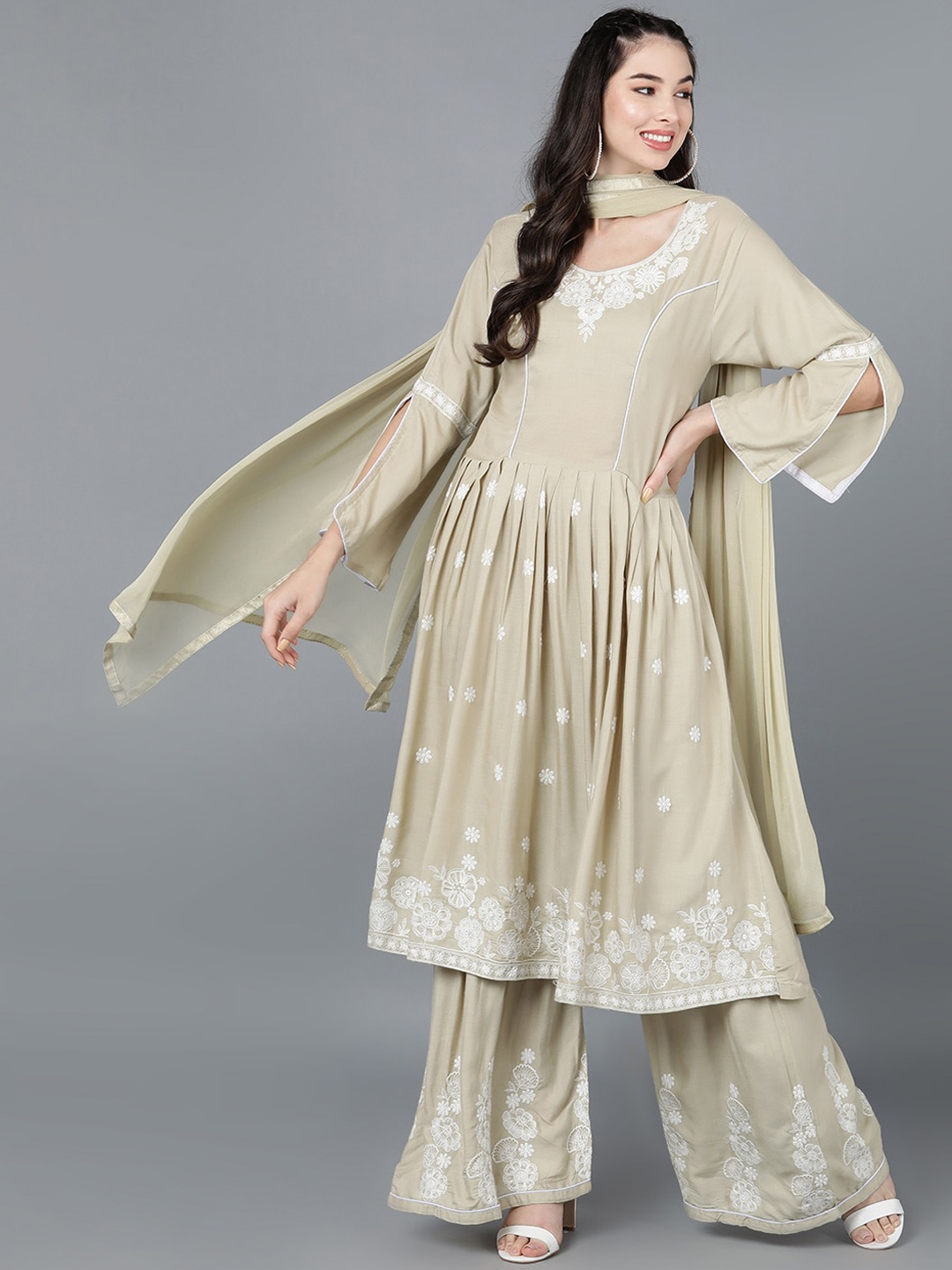 

AHIKA Women Beige Ethnic Motifs Embroidered Kurta with Sharara With Dupatta