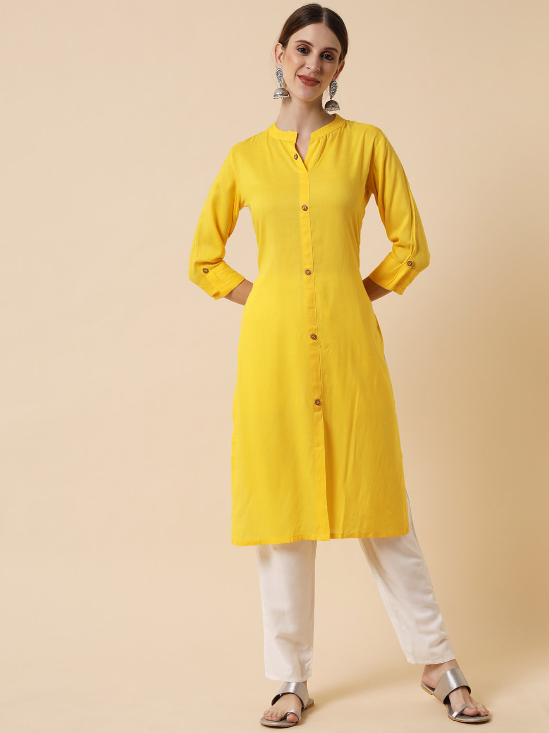 

Meeranshi Women Yellow Kurta and trouser