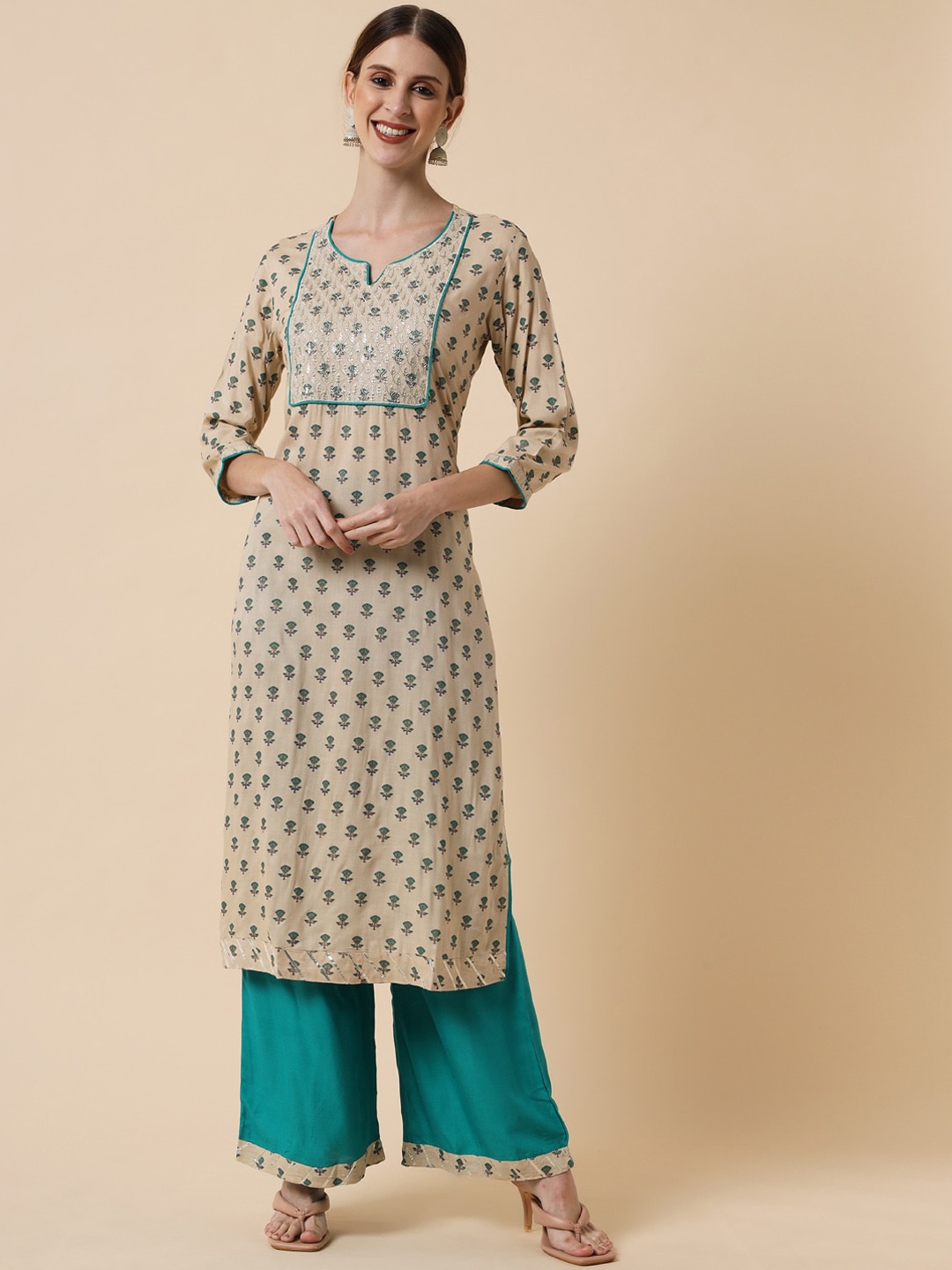 

Meeranshi Women Cream-Coloured Ethnic Motifs Yoke Design Sequinned Kurta with Palazzos