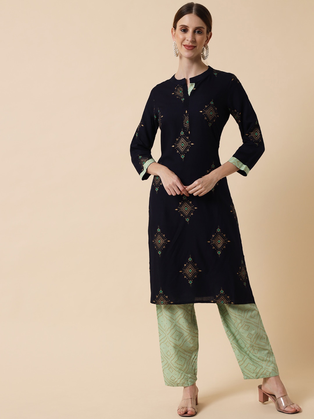 

Meeranshi Women Navy Blue Ethnic Motifs Embroidered Empire Kurti with Pyjamas