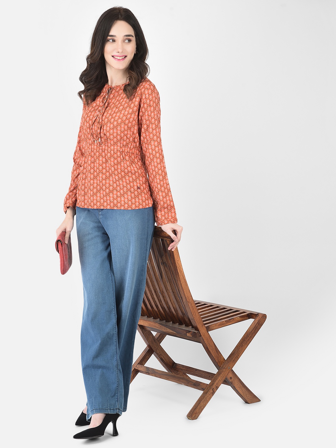 

Crimsoune Club Women Orange & russet Print Tie-Up Neck Top