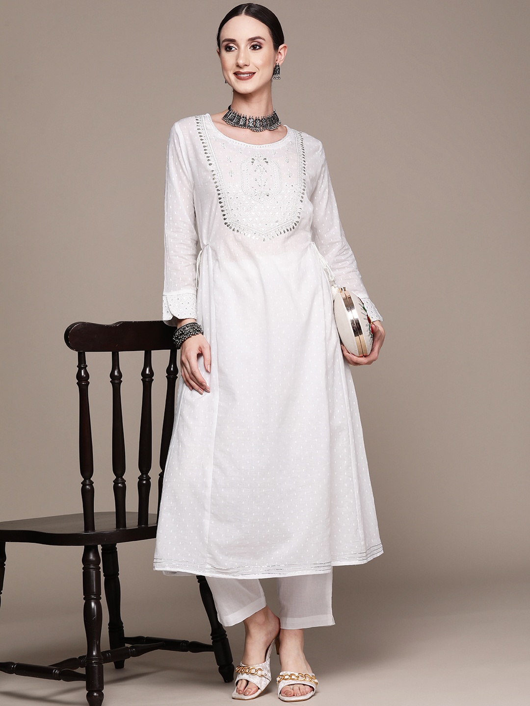 

Ishin Women White Ethnic Motifs Embroidered Kurta with Trousers