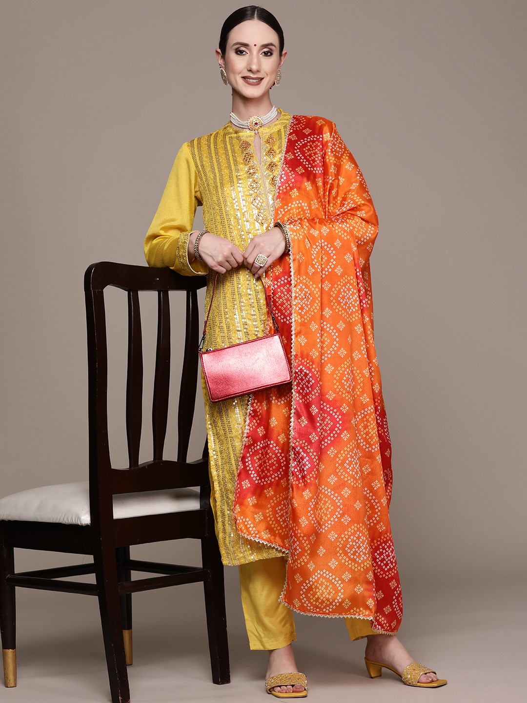 

Ishin Women Yellow Ethnic Motifs Embroidered Sequinned Silk Georgette Kurta with Trousers & With Dupatta