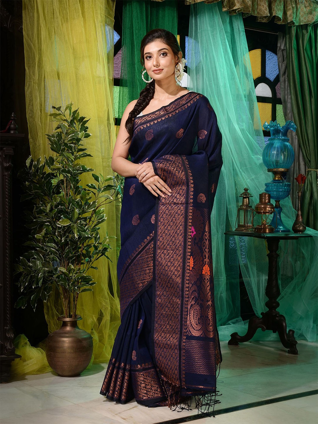 

Charukriti Blue & Copper-Toned Woven Design Zari Pure Linen Saree