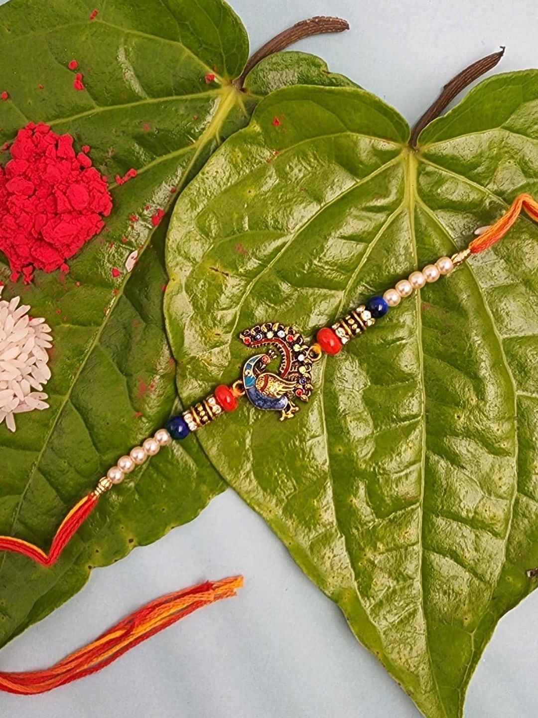 

YOUSTYLO Red Peacock Rakhi with Roli, Chawal