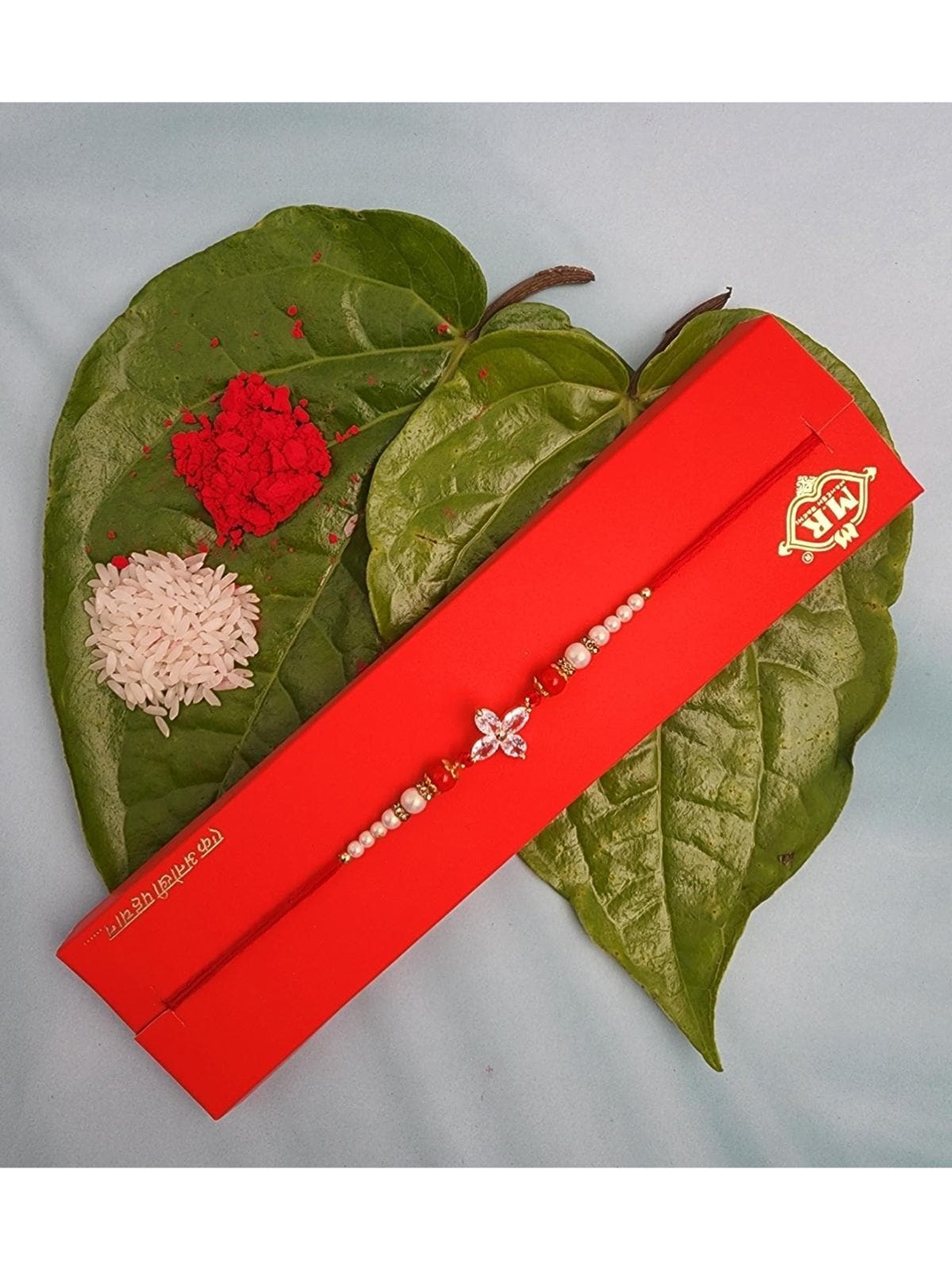 

YOUSTYLO Red Stone studded & Beaded Rakhi With Greeting Card & Roli Chawal