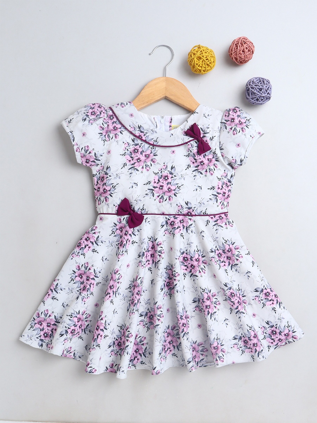 

The Magic Wand Girls White Floral Frock With Purple Bow