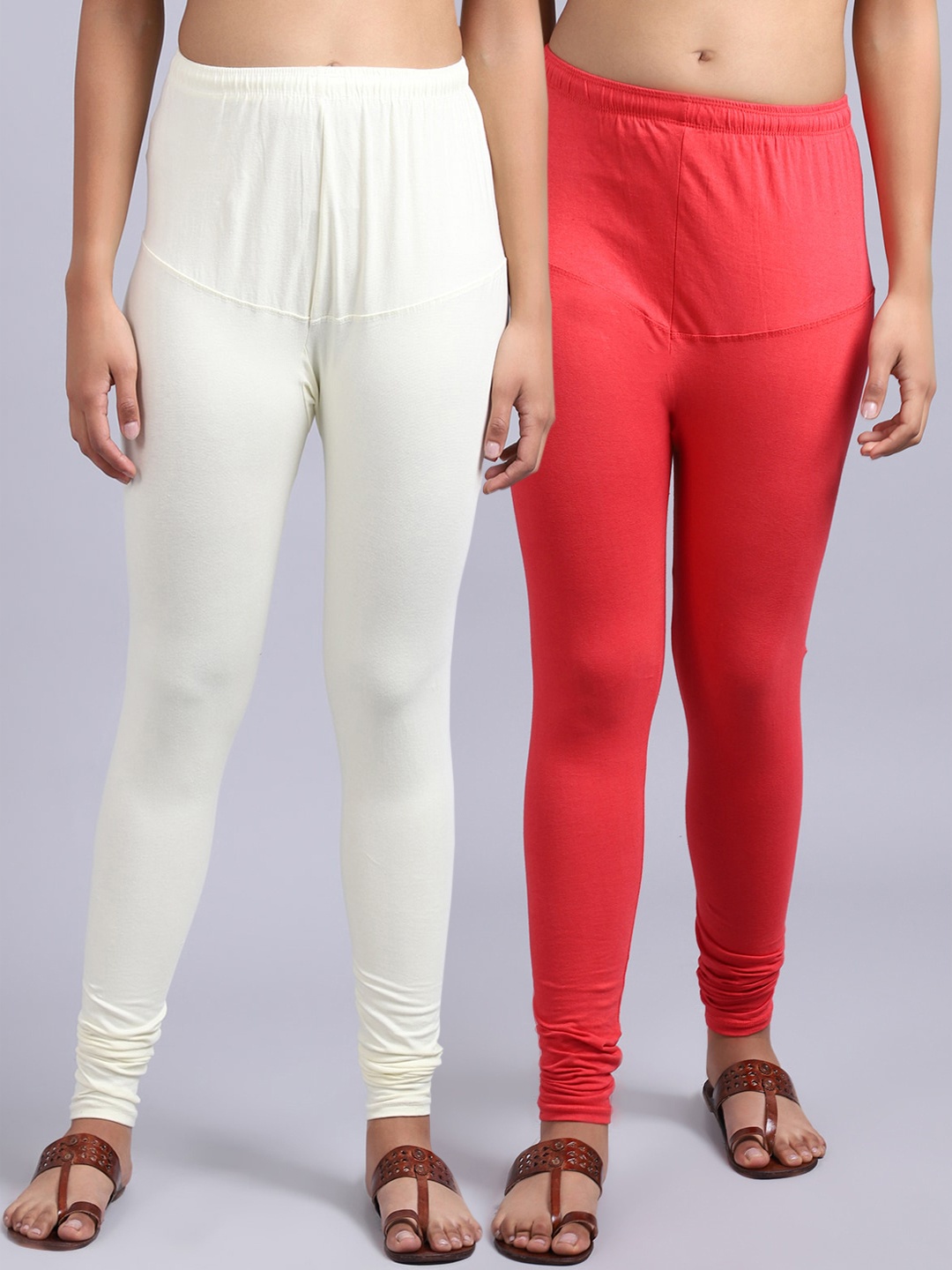 

Jinfo Women Pack Of 2 White & Orange Solid Churidar Length Leggings