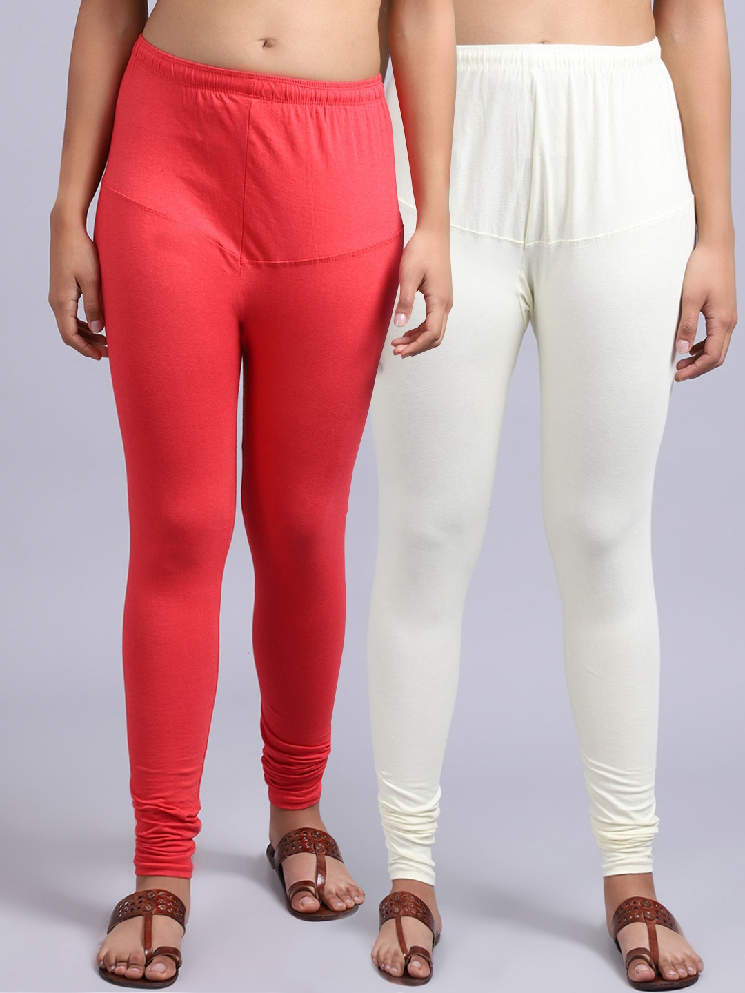 

GRACIT Women Pack Of 2 Orange & Off White Solid Churidar Length Leggings