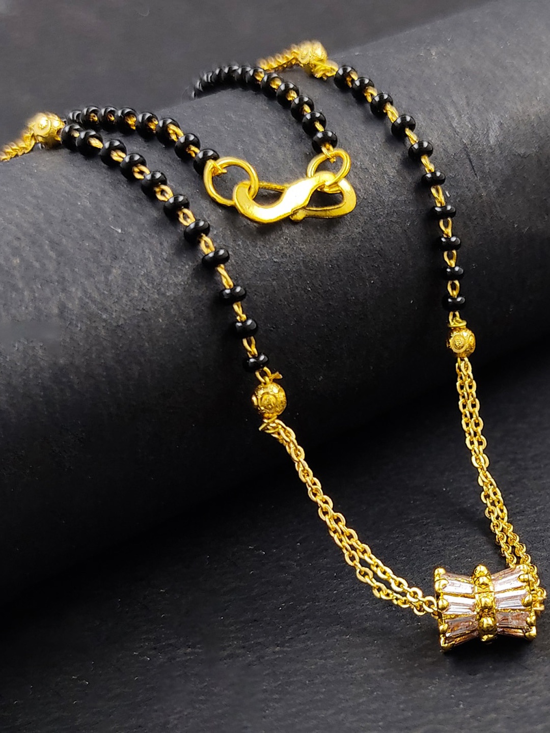 

Saizen Gold-Plated White AD-Studded & Black Beaded Mangalsutra